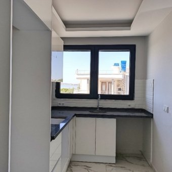 Ayvalık Güzelbahçe Evlerinde Deniz Manzaralı 2+1 Sıfır Satılık Lüks Daire.